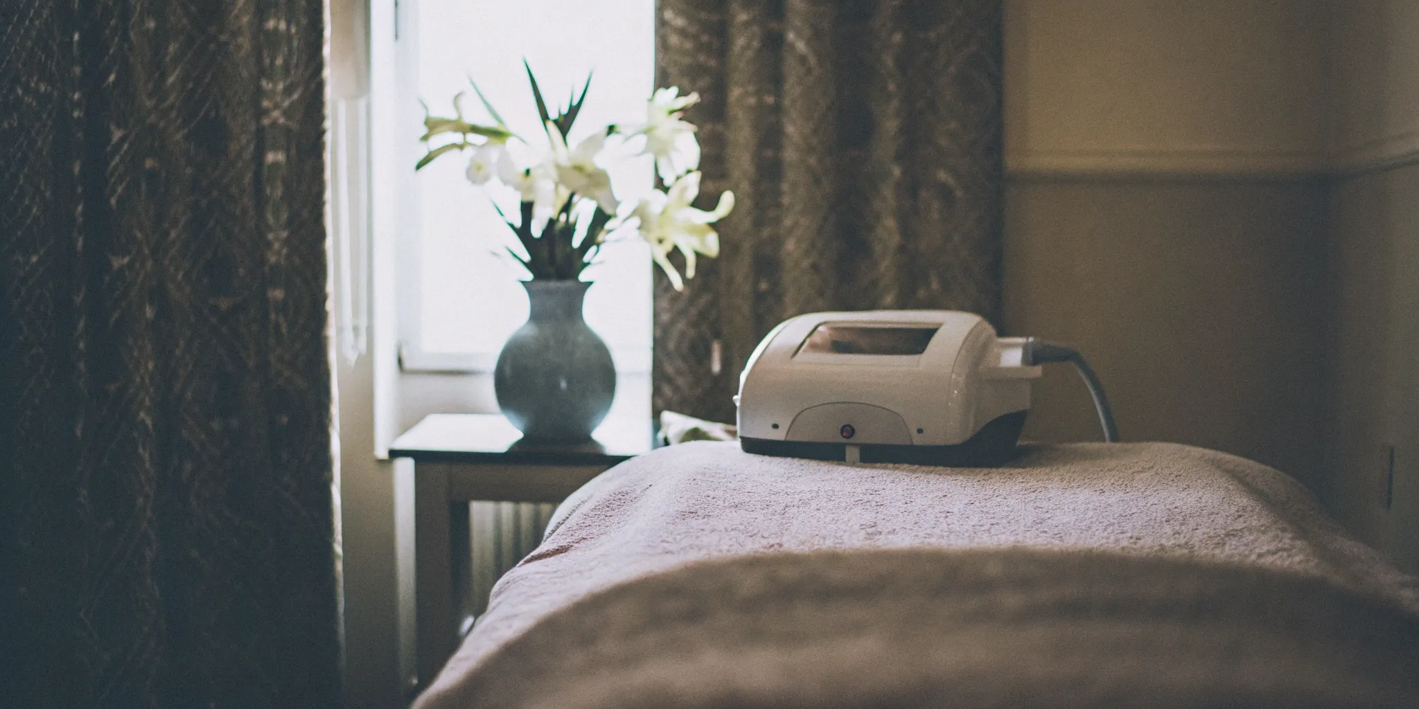 A professional laser hair removal machine in a medspa treatment room in Alexandria, VA.